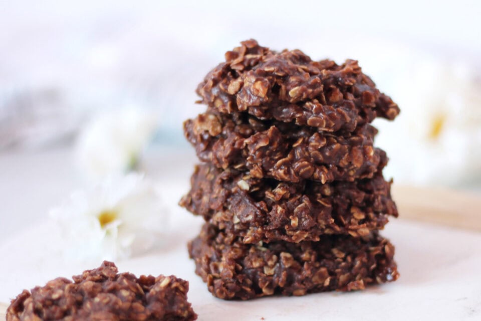 Four no bake cookies stacked on top of each other.