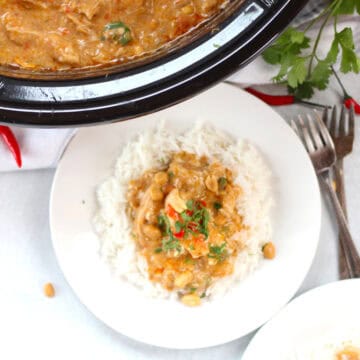 Chicken panang curry served on a white plate and in a slow cooker.