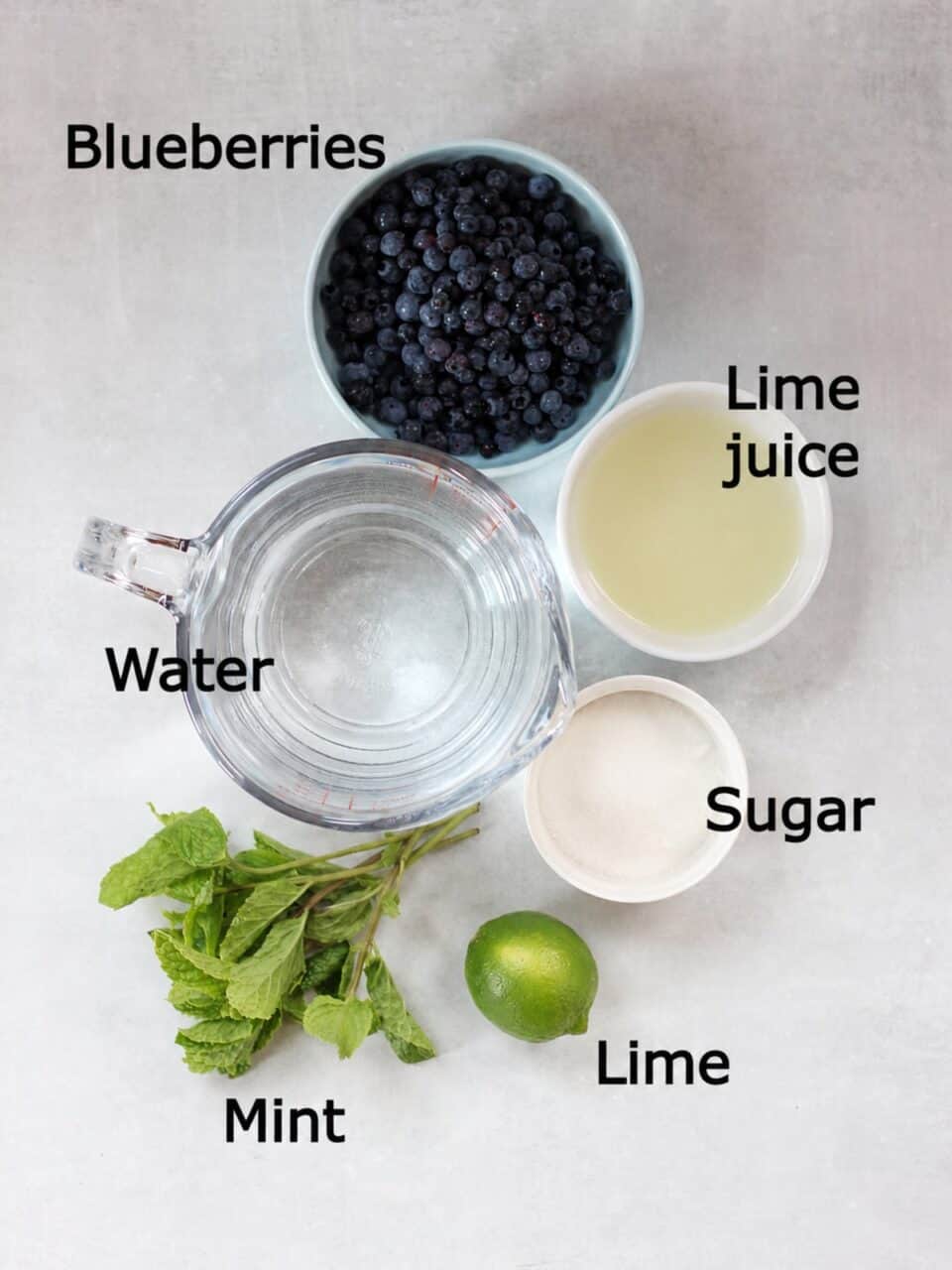 Ingredients needed to make blueberry limeade recipe.