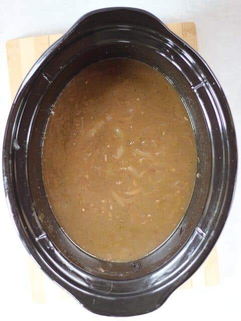 Finished onion gravy in a slow cooker.