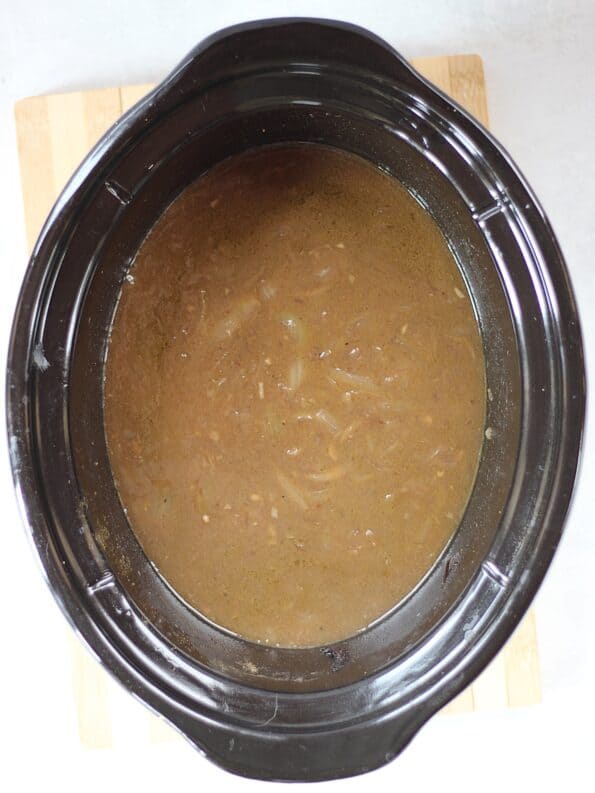 Finished onion gravy in a slow cooker.