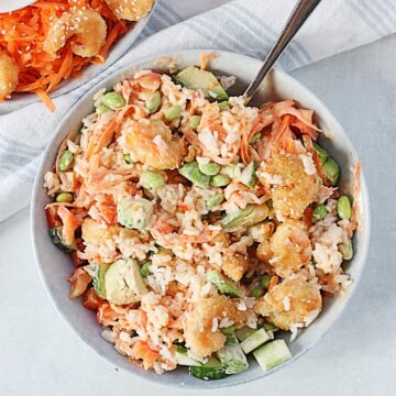 Crispy sweet chili rice bowl mixed together with a spoon.