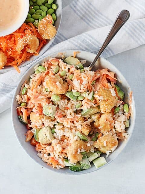Shrimp rice bowl with ingredients mixed together.