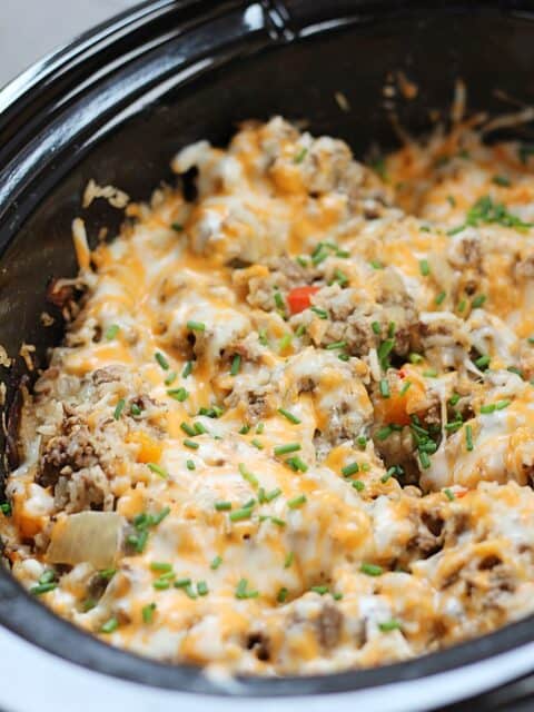 Cooked beef and rice in a slow cooker.