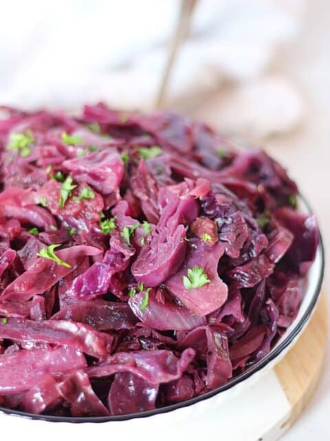 Slow cooker red cabbage in a serving bowl.