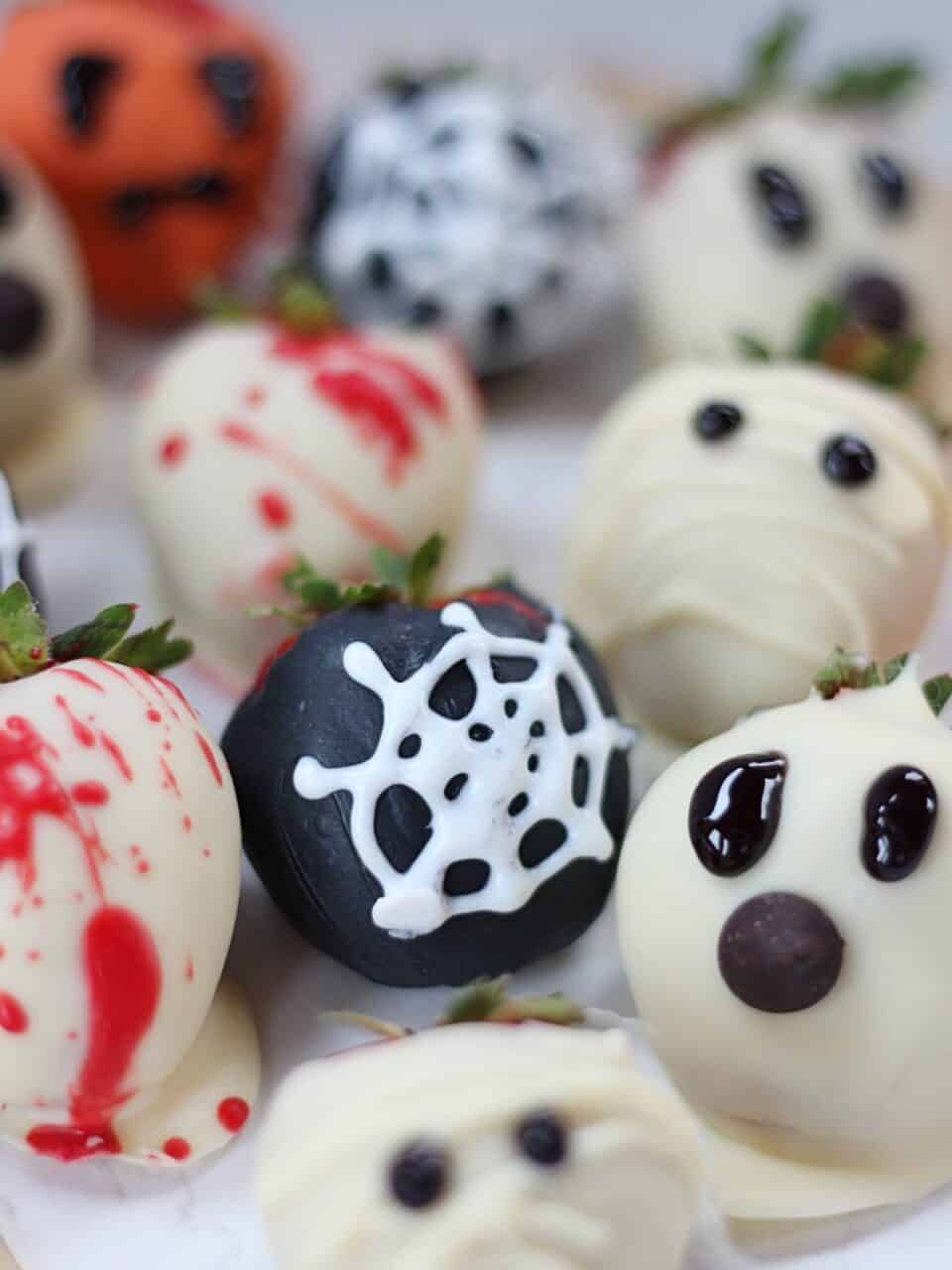 A spiderweb decorated strawberry.