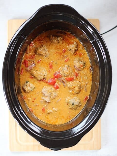 Curry and meatballs in a slow cooker.